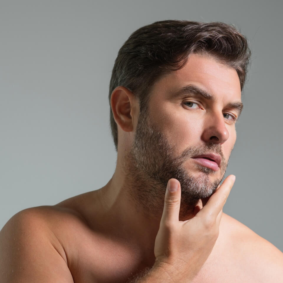 Cosmetic cream for man. Spa male model, skincare product for skin face. Morning mask for skin with anti-aging effect. Skin care. Male face cream. Man with perfect soft skin. Beauty cosmetic product.